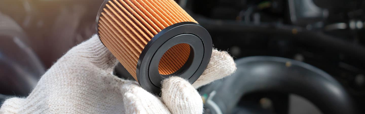 image of someone holding an oil filter